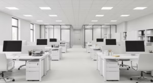Modern open-plan office space with white desks and clean surfaces after professional commercial cleaning service in Connecticut.